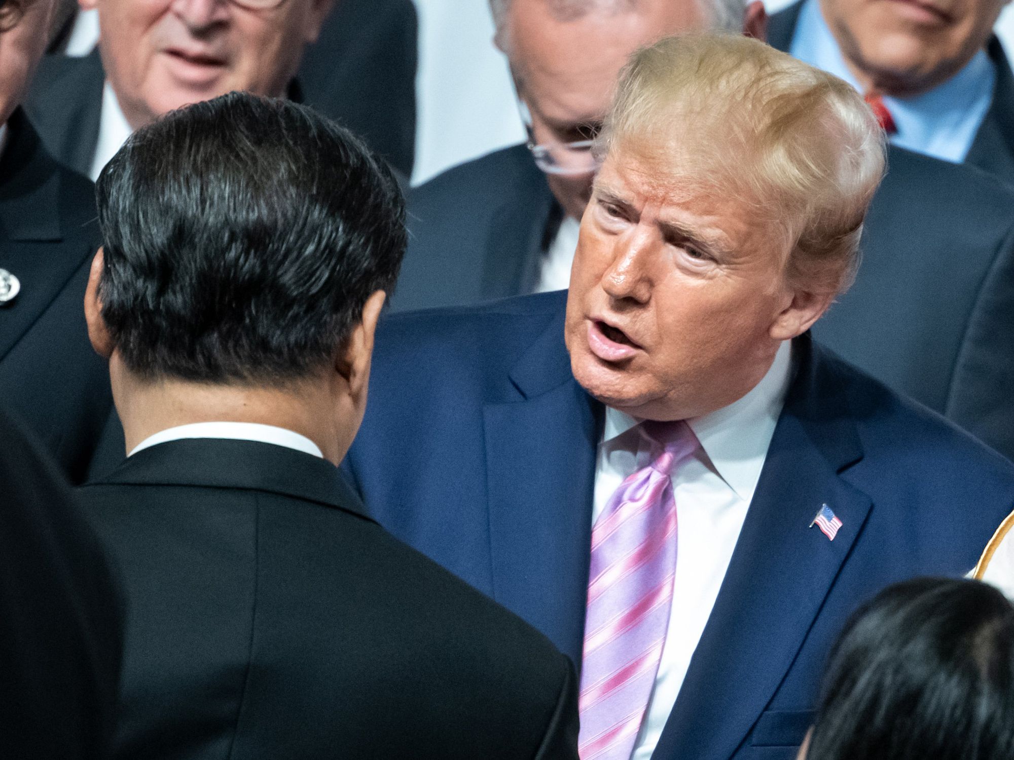 photo of trump and the back of Xi jinping