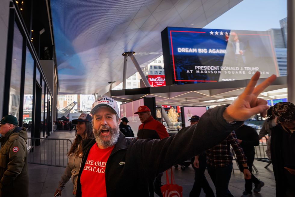 Photo of Trump supporters in MAGA attire, at Madison Square Garden in NYC on Oct. 27.
