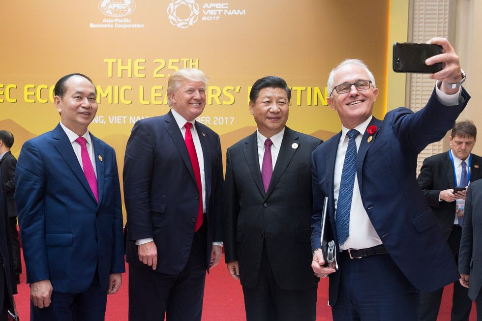 photo of trump xi and two others