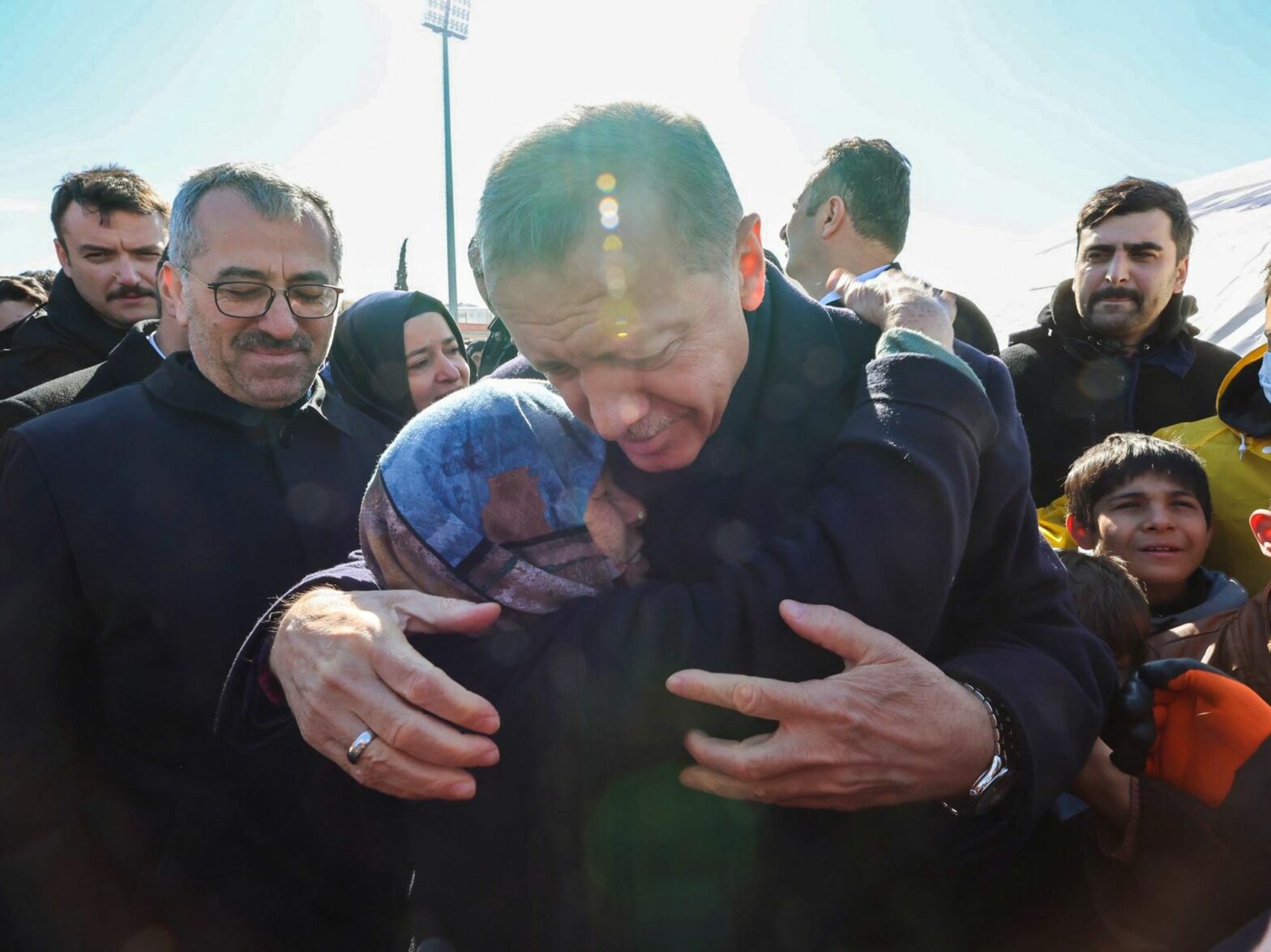 Photo of Turkish President Recep Tayyip Erdoğan consoles families as rescue workers inspect the earthquake-hit areas in Turkey.