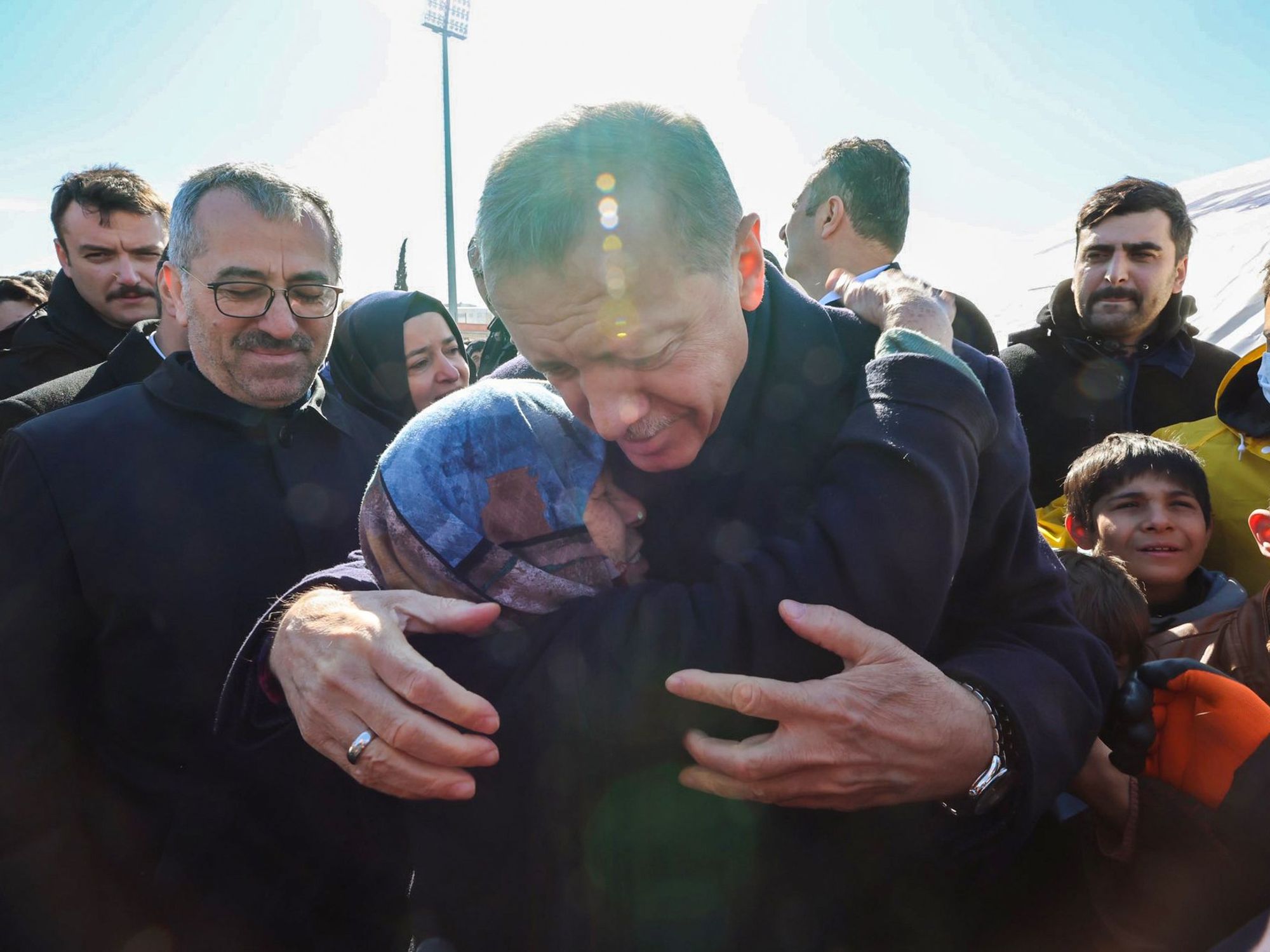 Photo of Turkish President Recep Tayyip Erdoğan consoles families as rescue workers inspect the earthquake-hit areas in Turkey.