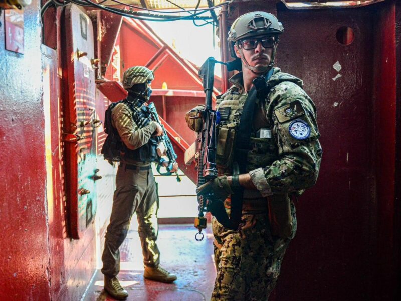 Photo of two IDF soldiers in full military gear during a mission