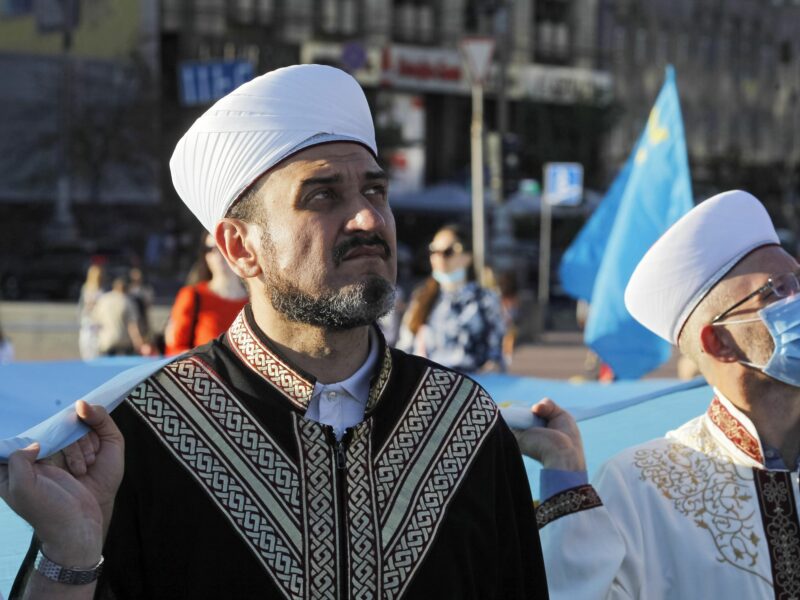 Photo of two men in traditional Tatar clothing and hats