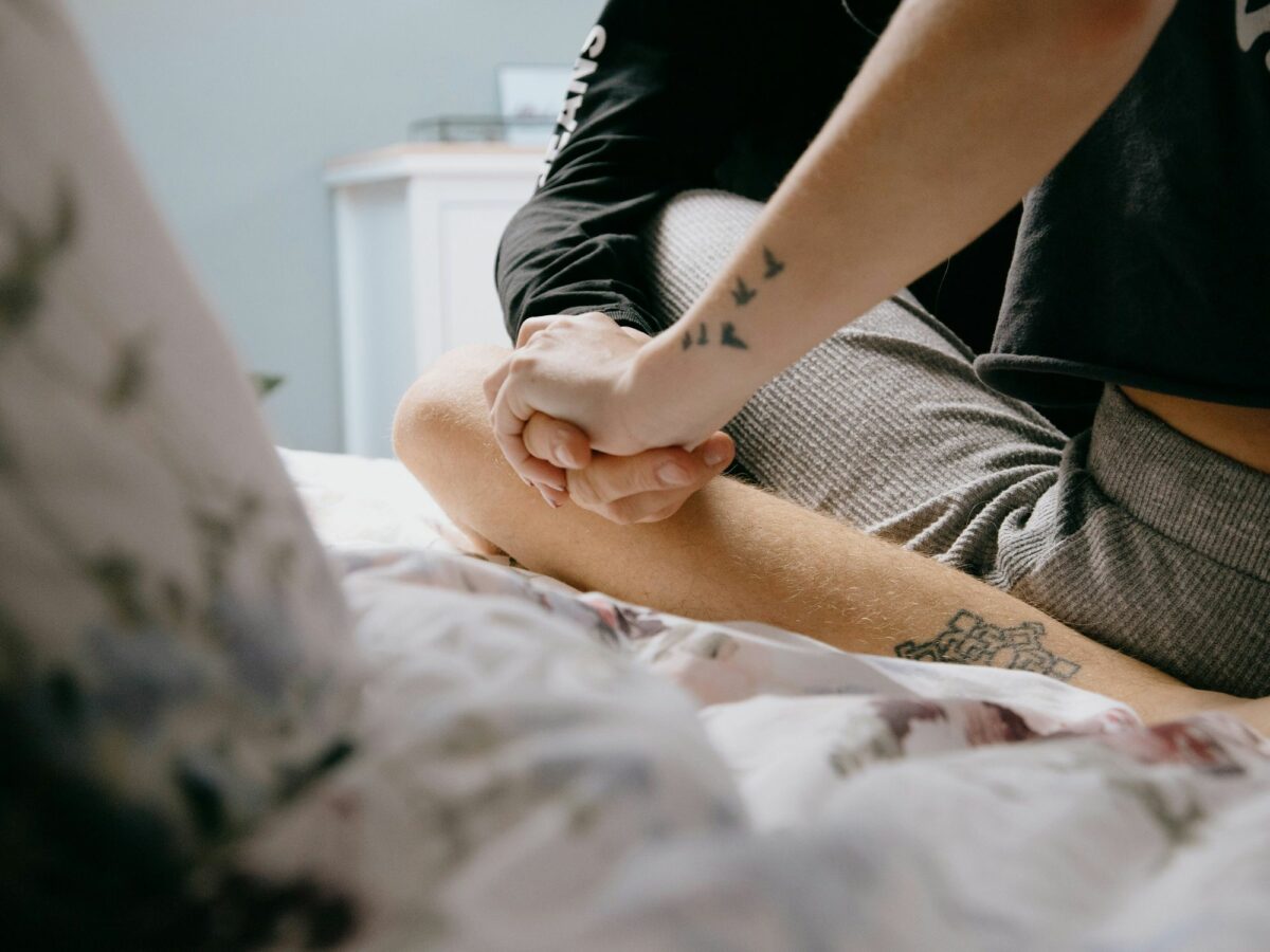 Photo of two people in bed