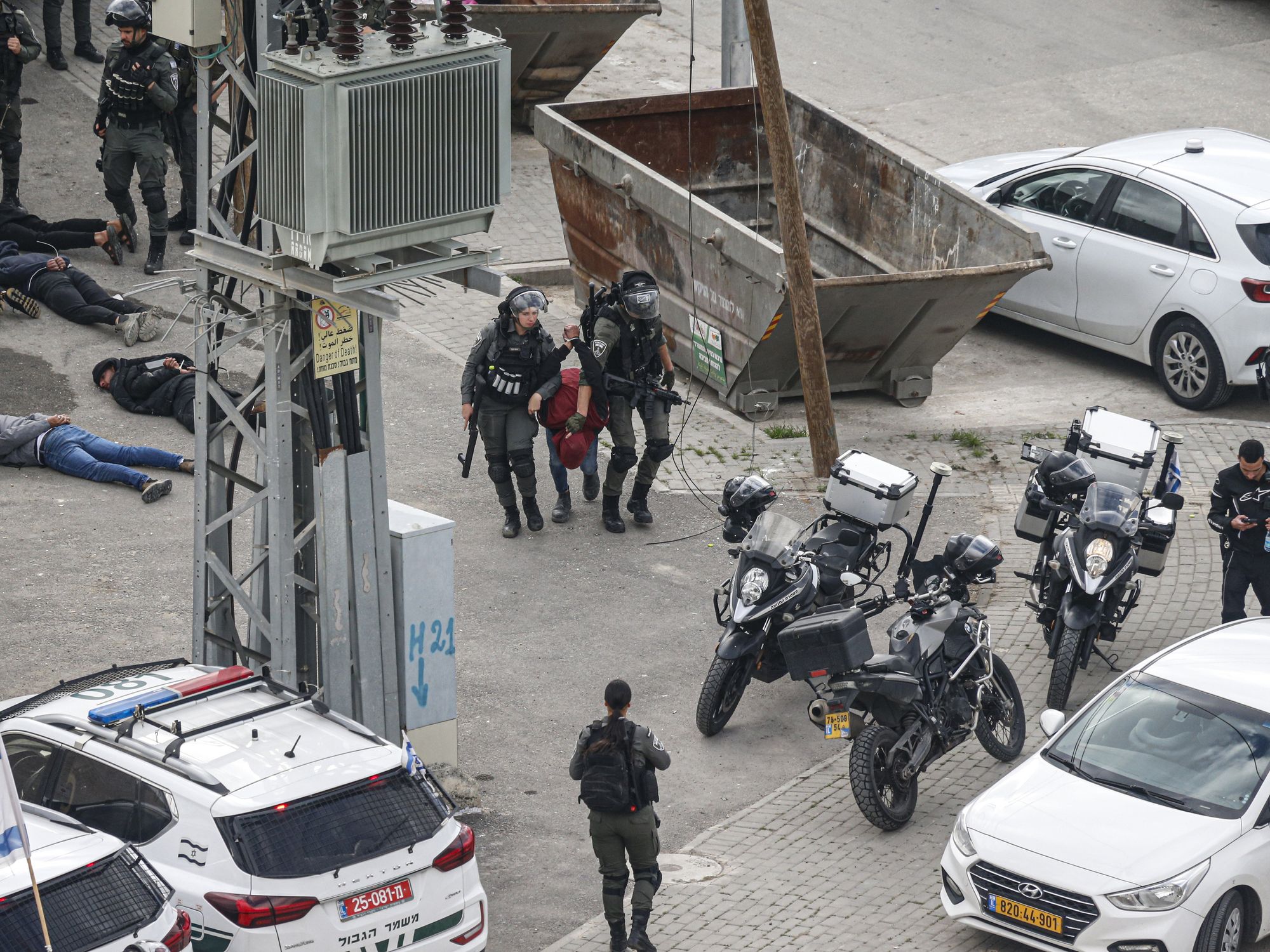 photo of two police arresting someone
