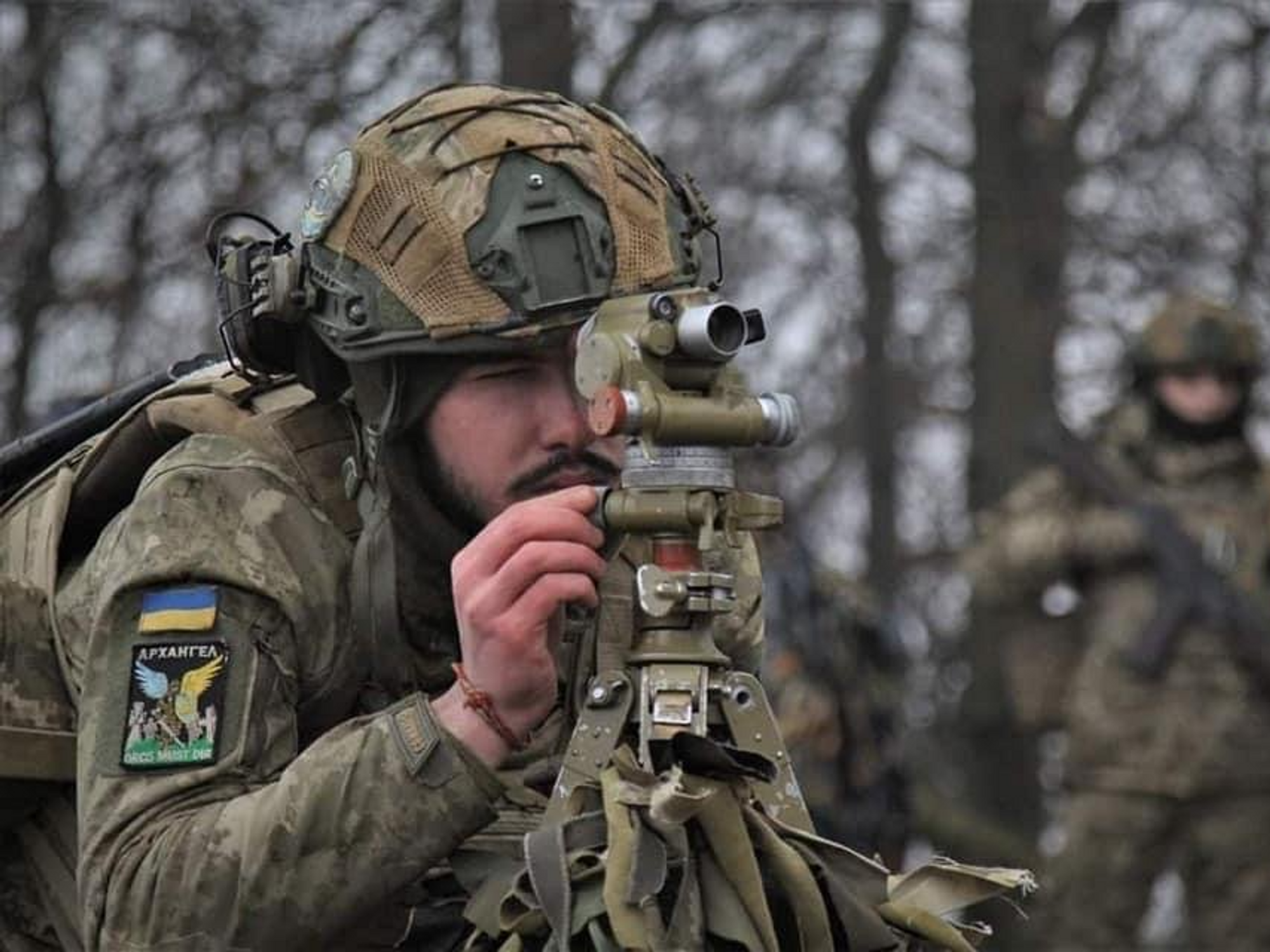 Photo of two Ukrainian soldiers surveilling the front lines