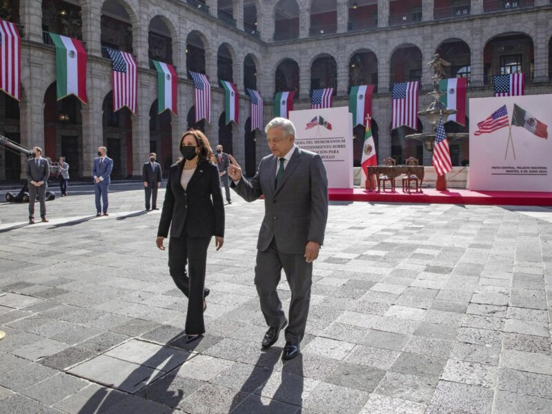 Photo of U.S. ​Vice President Kamala Harris and Mexican President AMLO walking in the couryyard of the National Palace during in Mexico City on June 8