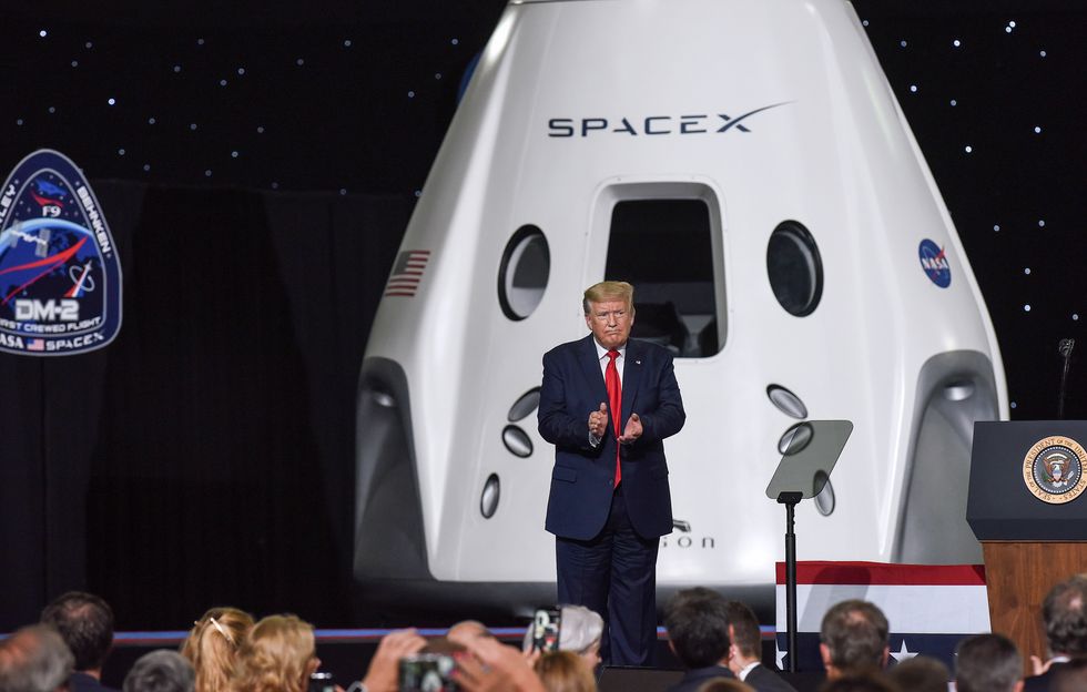 Photo of U.S. President Donald Trump in front of a SpaceX module after speaking at the Kennedy Space Center in Florida back in 2020.