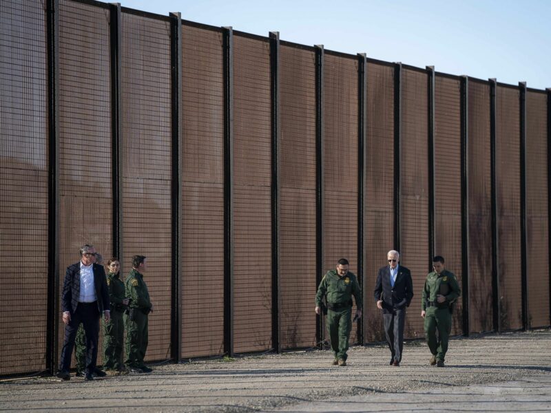 Photo of U.S President Joe Biden with Custom and Border Patrol officers during a visit to the border wall along the Rio Grande,