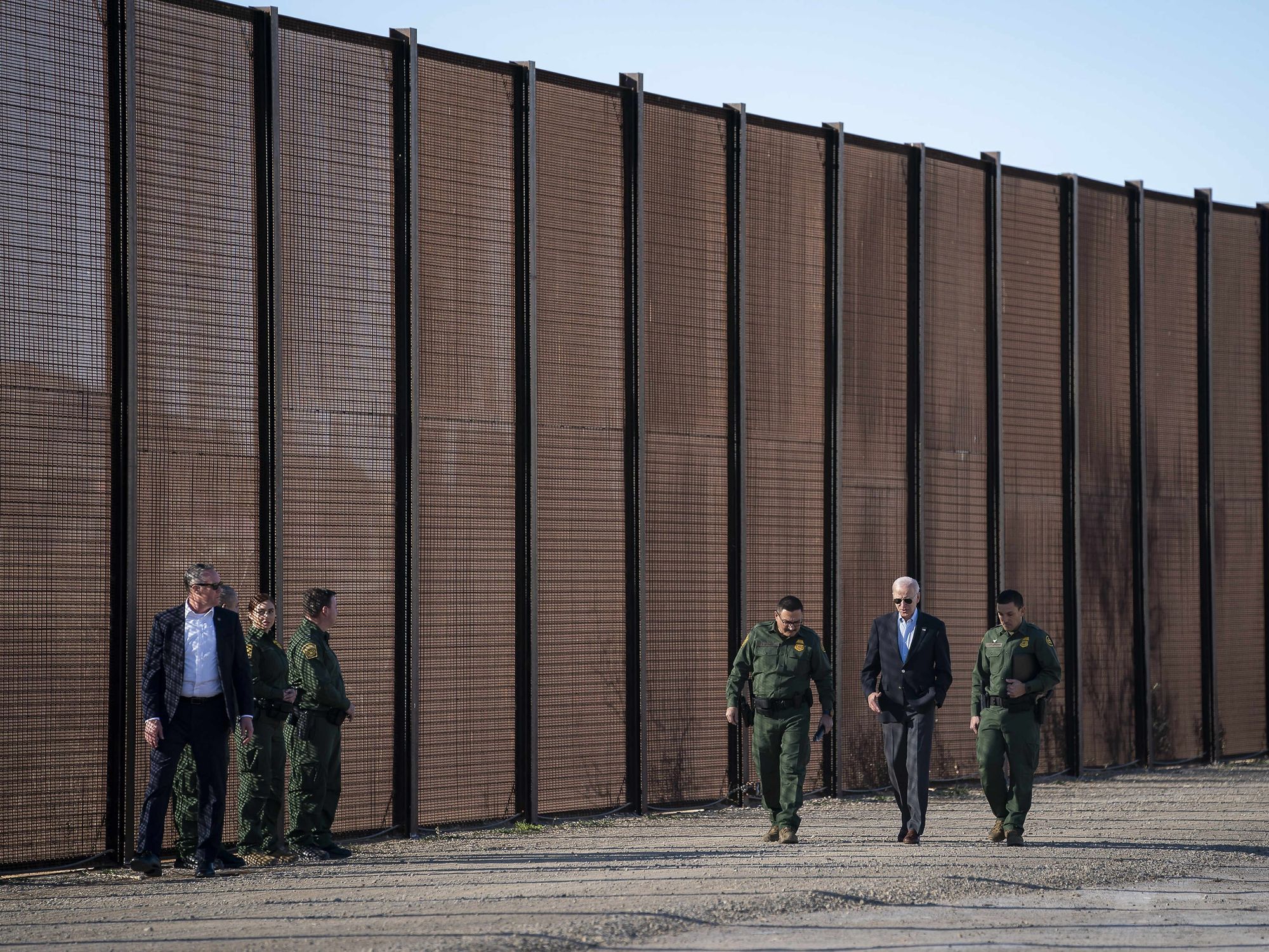 Photo of U.S President Joe Biden with Custom and Border Patrol officers during a visit to the border wall along the Rio Grande,