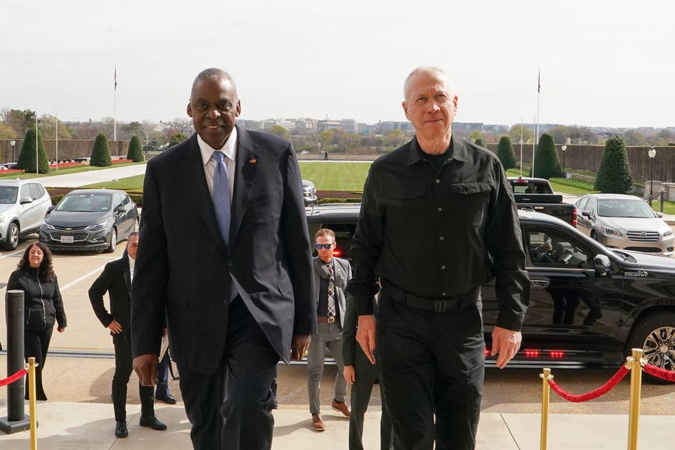 Photo of U.S. Secretary of Defense Lloyd Austin and Israel's Minister of Defense, Yoav Gallant walking side by side at the Pentagon on March 26.