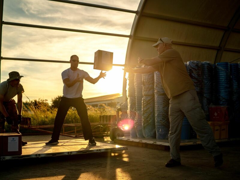 photo of U.S. service members assigned to Combined Joint Task Force-Horn of Africa (CJTF-HOA) and a member of the U.S. Agency for International Development (USAID) build pallets of humanitarian aid to later be transported to Maputo, Mozambique, after Cyclone Idai devasted the area in March 2019.​