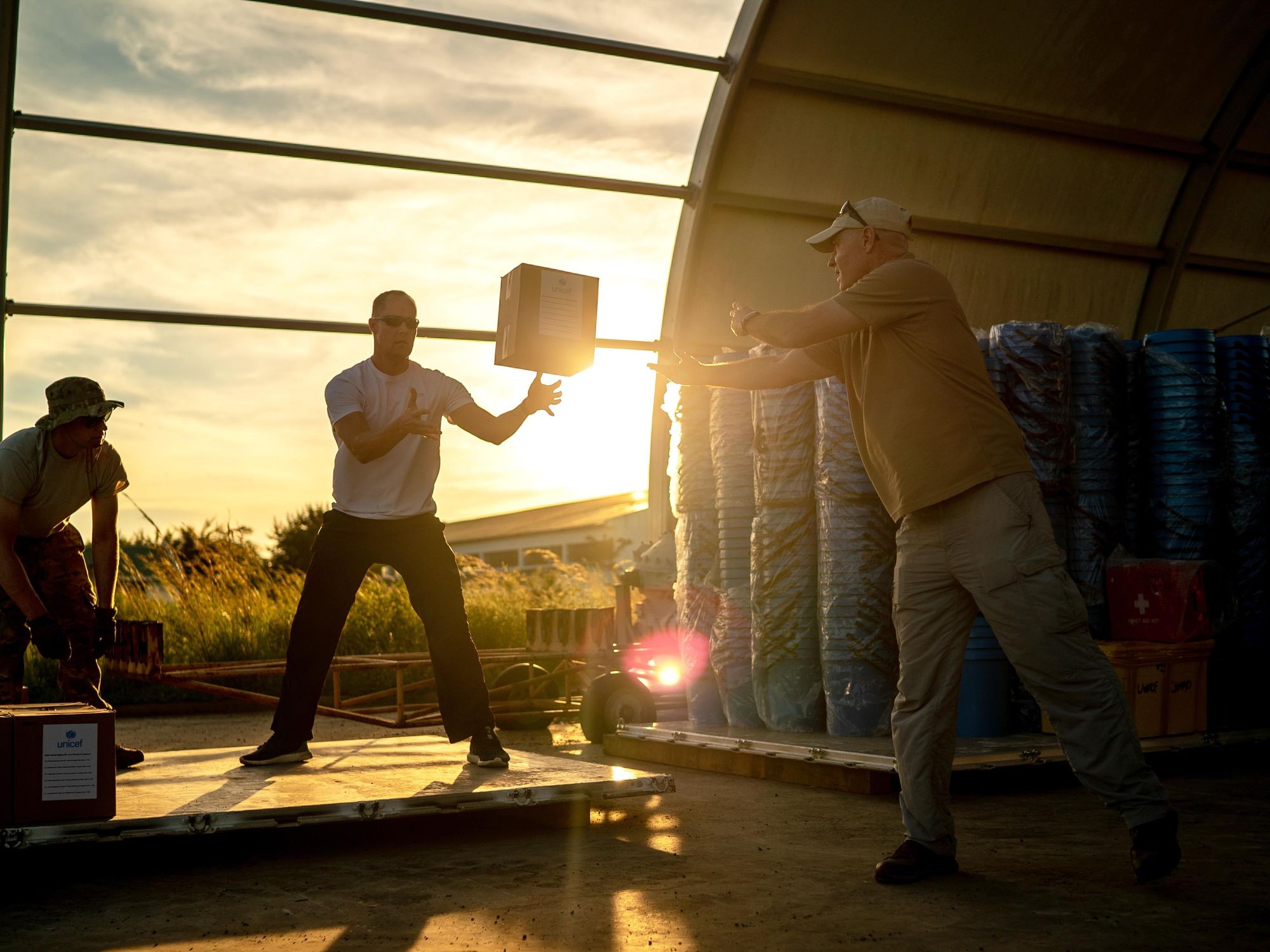photo of U.S. service members assigned to Combined Joint Task Force-Horn of Africa (CJTF-HOA) and a member of the U.S. Agency for International Development (USAID) build pallets of humanitarian aid to later be transported to Maputo, Mozambique, after Cyclone Idai devasted the area in March 2019.​