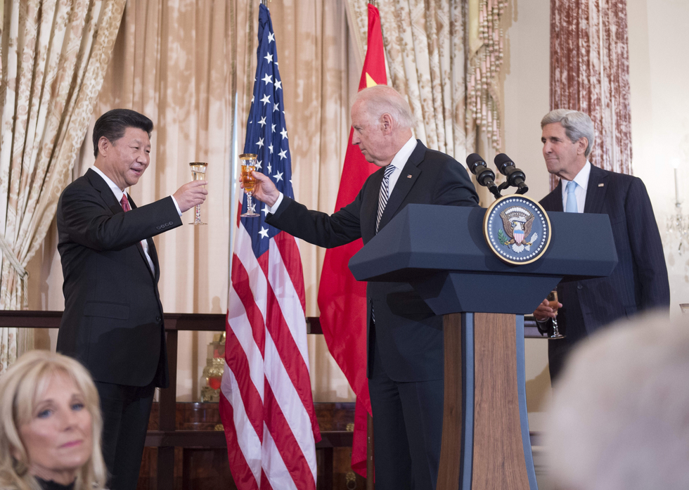 Photo of U.S. Vice President Joe Biden raises his glass to toast Chinese President Xi Jinping at a State Luncheon.