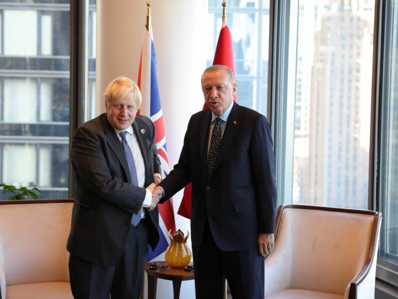Photo of UK Prime Minister Boris Johnson and Turkish President Recep Tayyip Erdogan shaking hands as they meet in New York on September 20, 2021