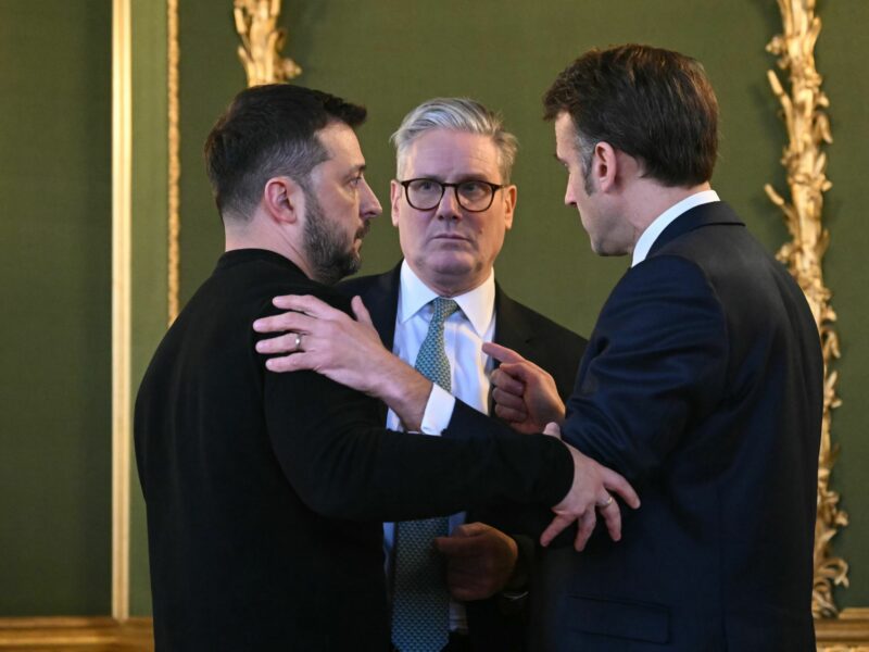 Photo of Ukraine's President Volodymyr Zelensky, Britain's Prime Minister Keir Starmer and France's President Emmanuel Macron embracinf after meeting in London on March 2