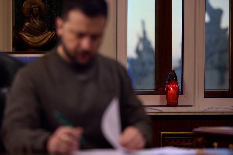 Photo of Ukrainian President Volodymyr Zelensky at his desk