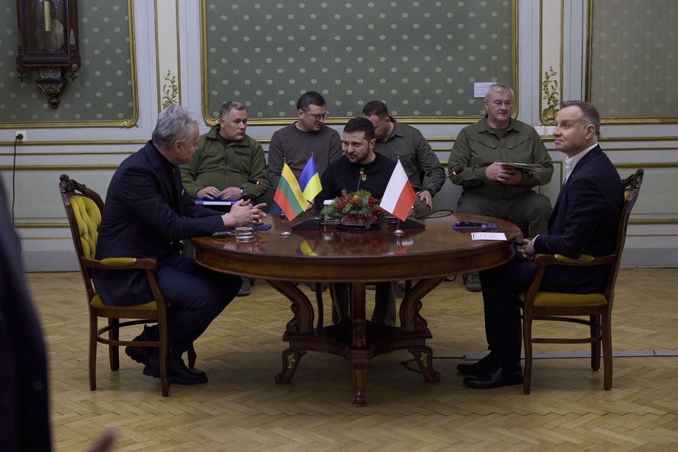 PHoto of Ukrainian President Zelensky, center, Lithuanian President Gitanas Nauseda, left, and Polish President Andrzej Duda, right,