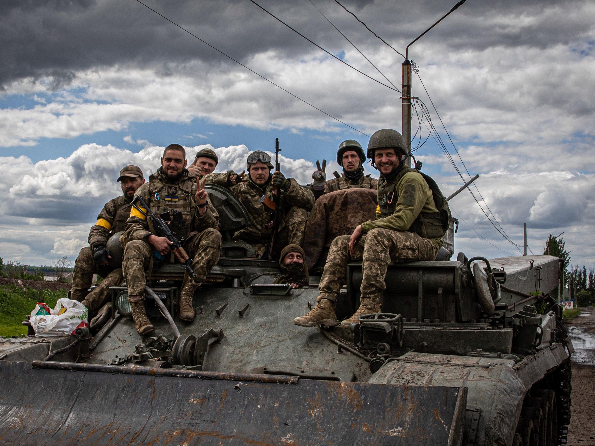 Photo of Ukrainian soldiers sitting atop a tank near the Russian frontlines in Donbas on May 22