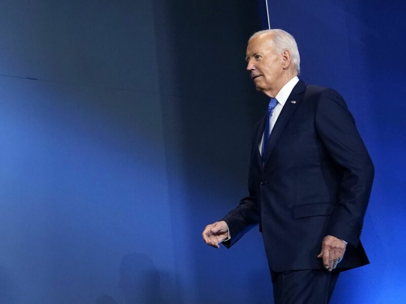Photo of United States President Joe Biden walking on stage in Washington, DC on July 11