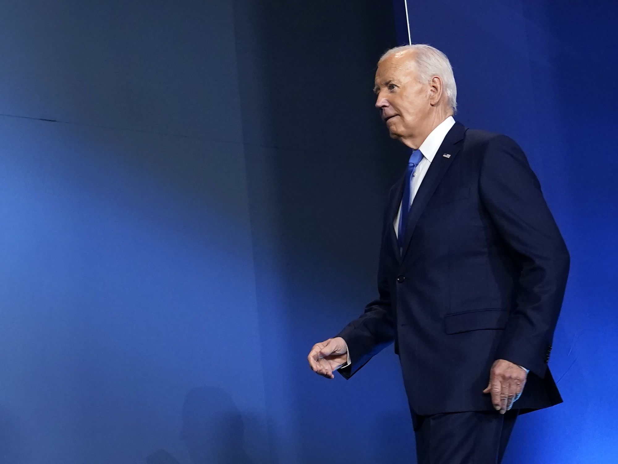 Photo of United States President Joe Biden walking on stage in Washington, DC on July 11