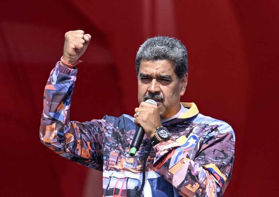 Photo of Venezuelan President Nicolas Maduro holding a microphone as he gives a speech in Maturin, Venezuela.