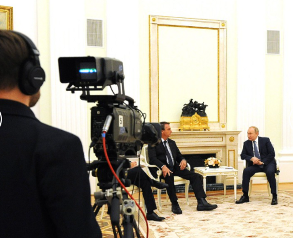 Photo of Vladimir ​Putin in talks with Brazil's Jair Bolsonaro in Moscow