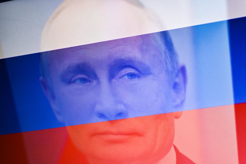 Photo of Vladimir Putin with a Russian flag