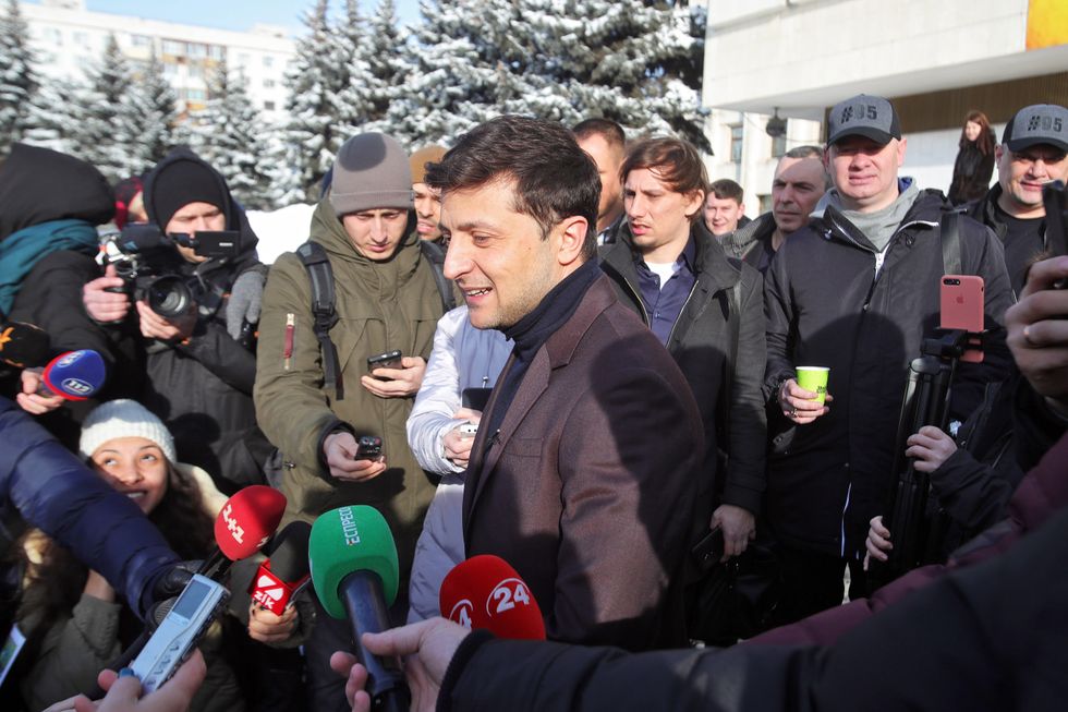 Photo of Volodymyr Zelensky answering reporters' questions after submitting documents necessary for the registration as a presidential candidate in 2019