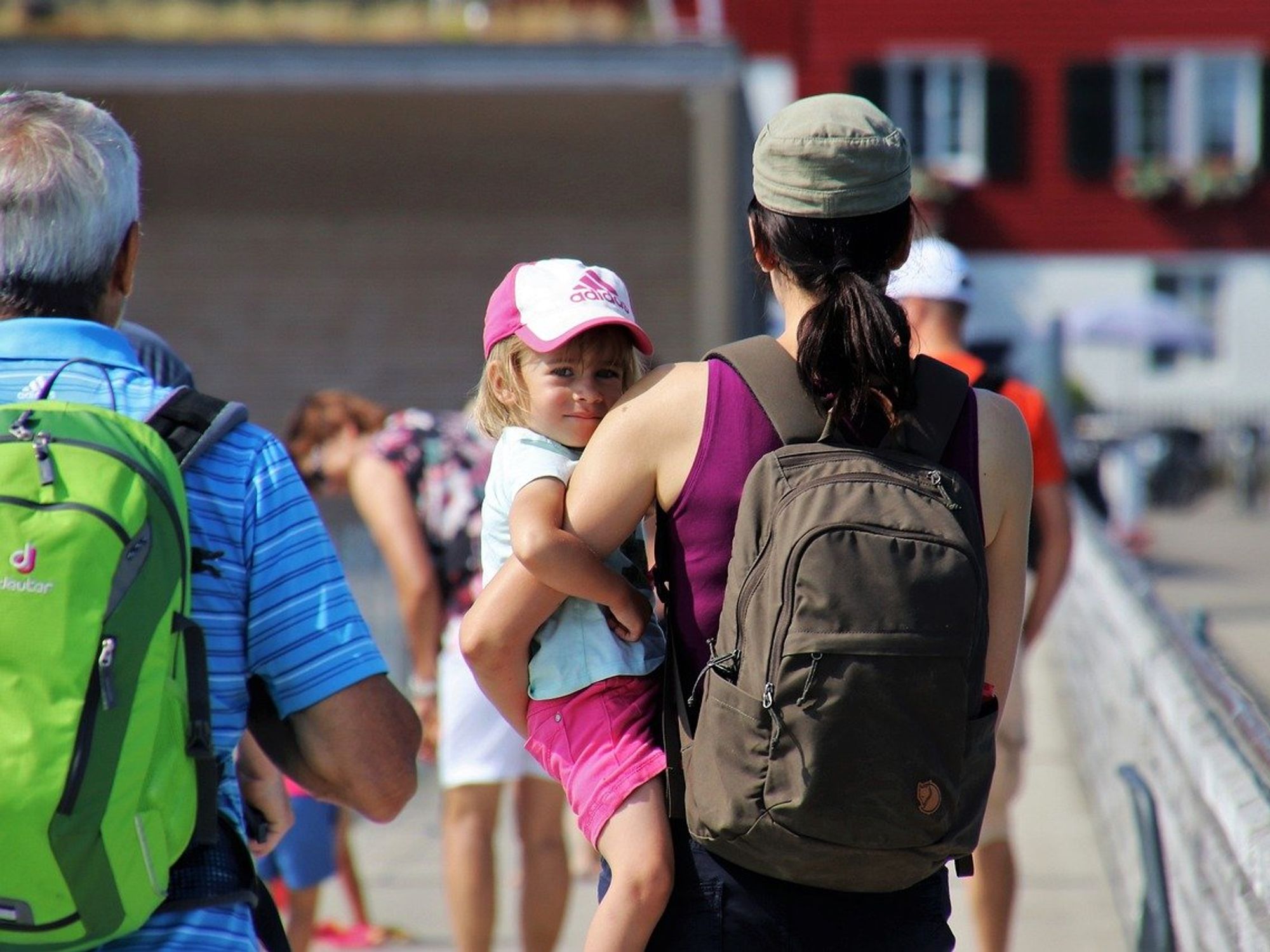 Photo of woman carrying a child