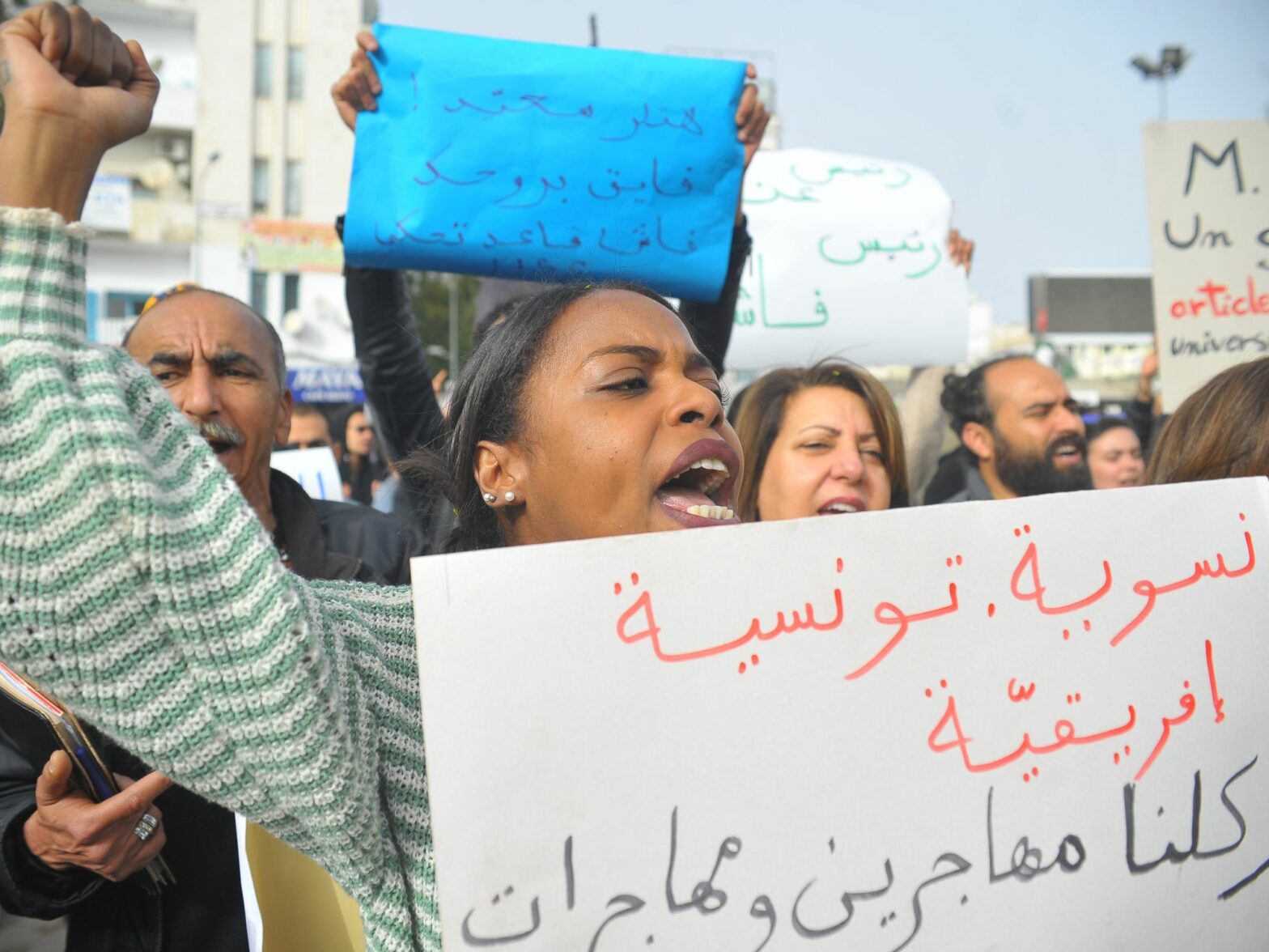 Photo of woman protesting against Tunisian President Kais Saied in Tunis