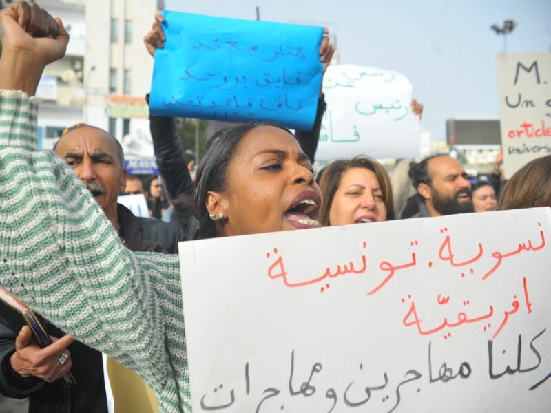 Photo of woman protesting against Tunisian President Kais Saied in Tunis