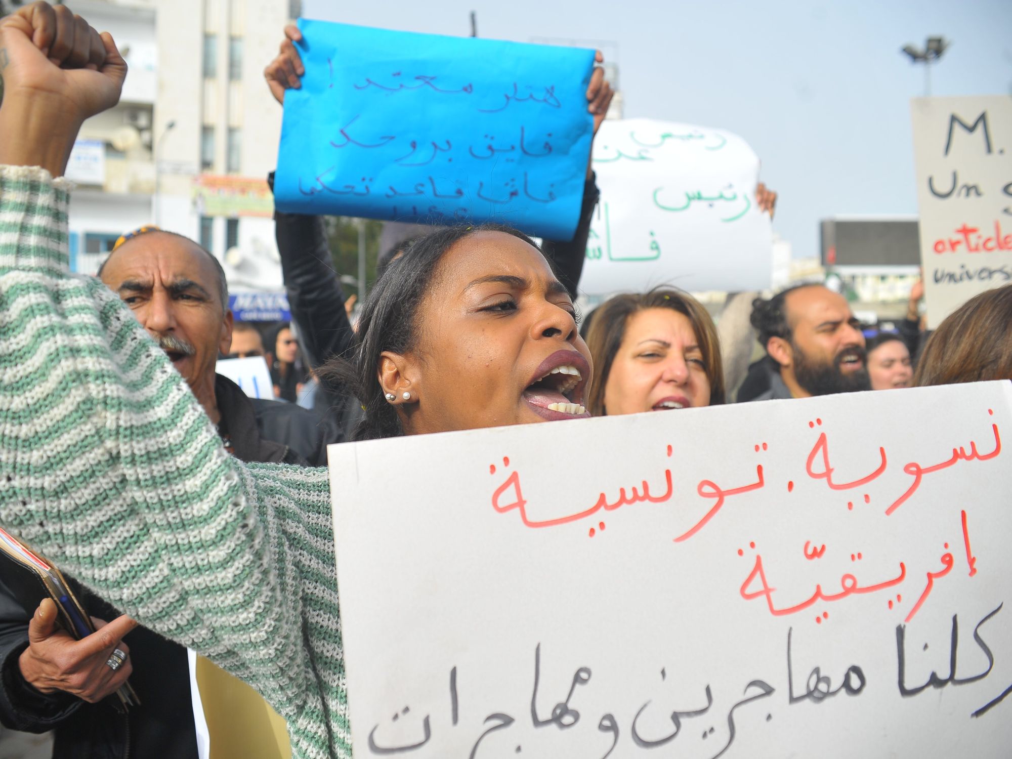 Photo of woman protesting against Tunisian President Kais Saied in Tunis