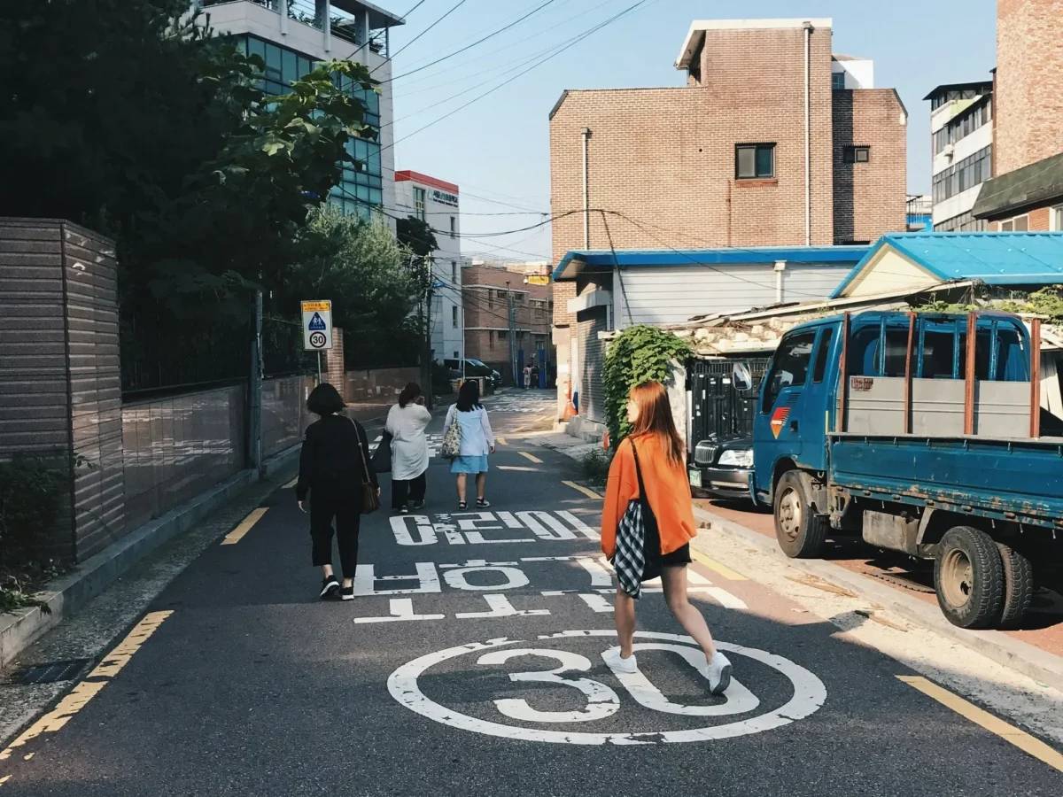 Photo of women crossing a street in Seoul, South Korea