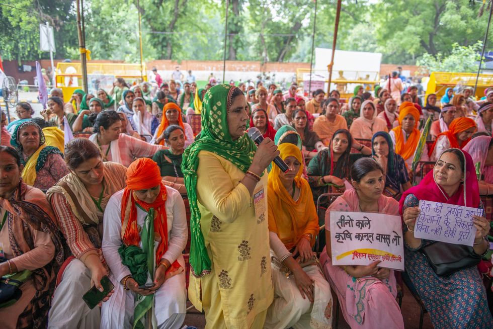 Photo of women gathering together to speak up about the roles they play in Indian agriculture back in July 2021.