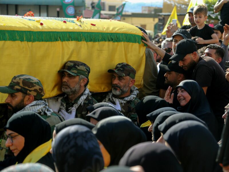 Photo of women grieving during the funeral procession for a Hezbollah militant in Abbasiyeh, southern Lebanon.