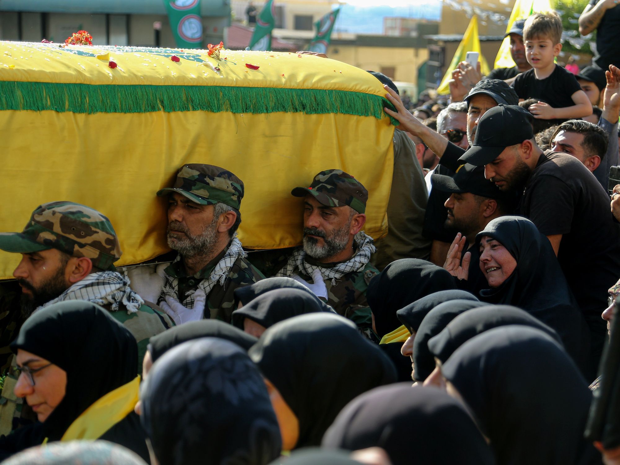 Photo of women grieving during the funeral procession for a Hezbollah militant in Abbasiyeh, southern Lebanon.