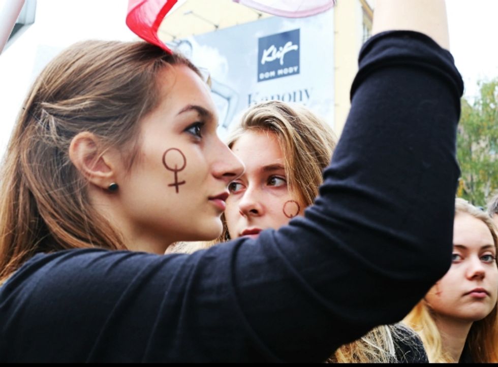 Photo of women protesting PiS’s near-total restrictions on abortion, in Warsaw, Poland