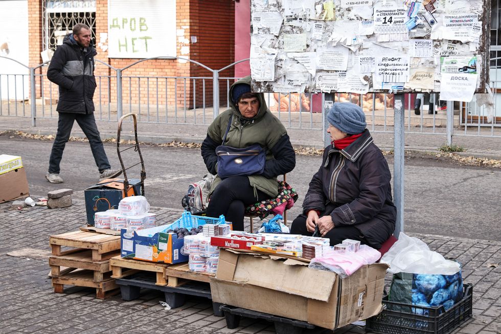 Photo of women selling goods at a market in Mariupol