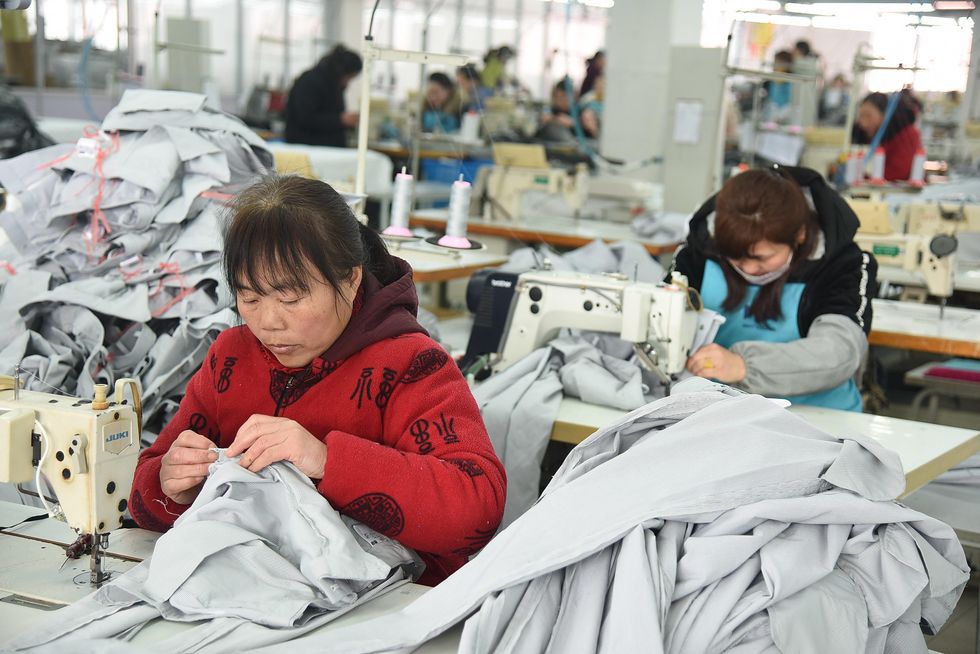 Photo of workers in a clothes factory
