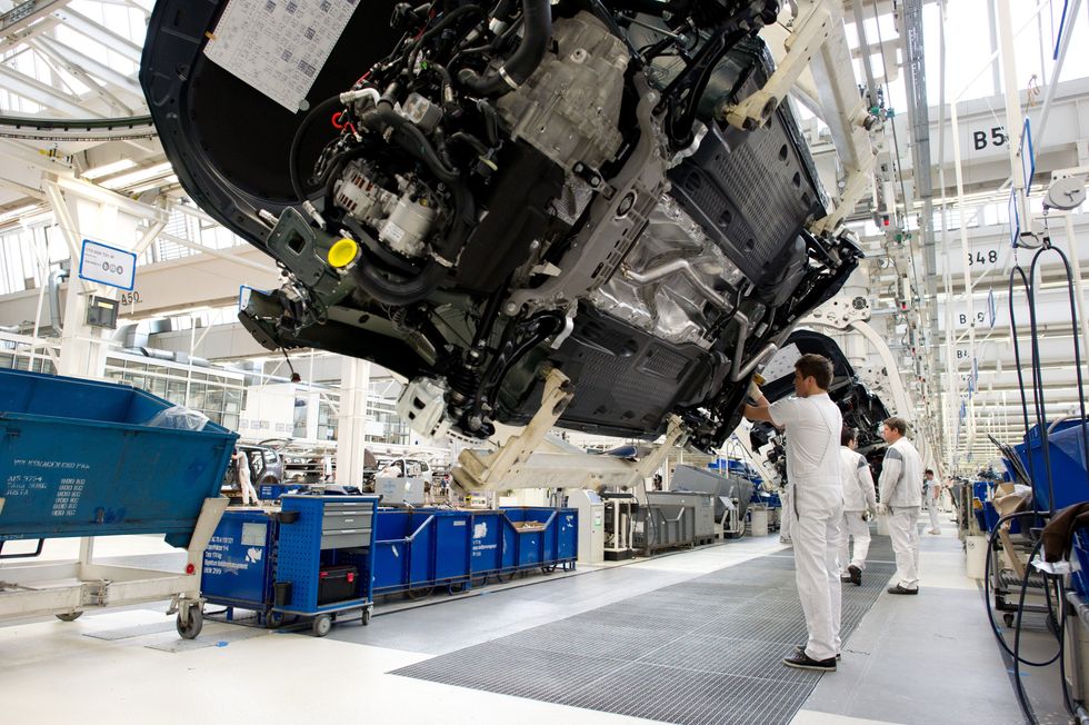 photo of workers on an auto assembly line