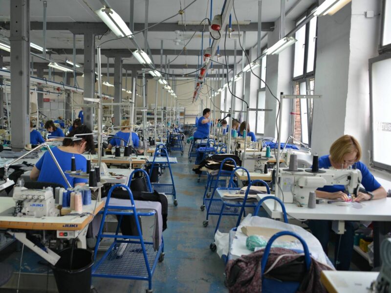 Photo of workers sewing at "Joan's sewing shop” in Łódź