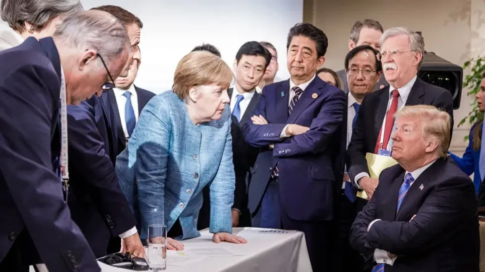 Photo of world leaders around Donald Trump at G7 summit