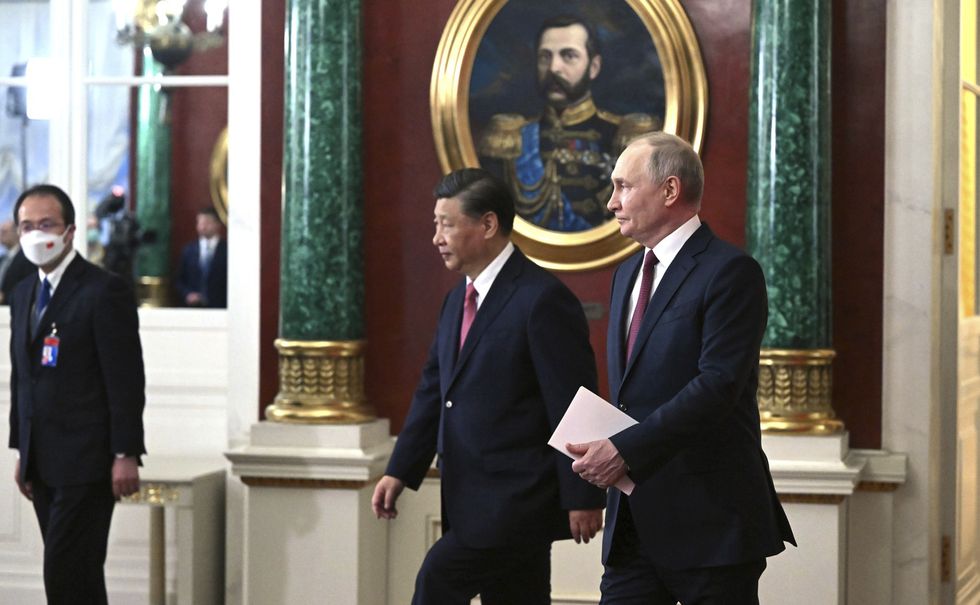photo of xi and putin walking