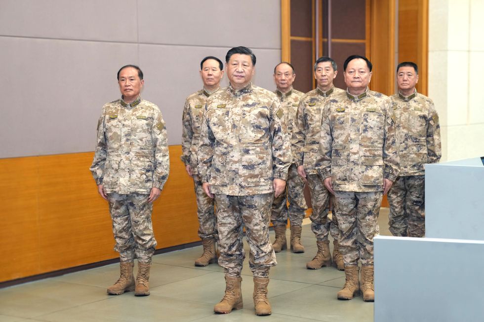 Photo of Xi Jinping and other Chinese officials in military fatigues