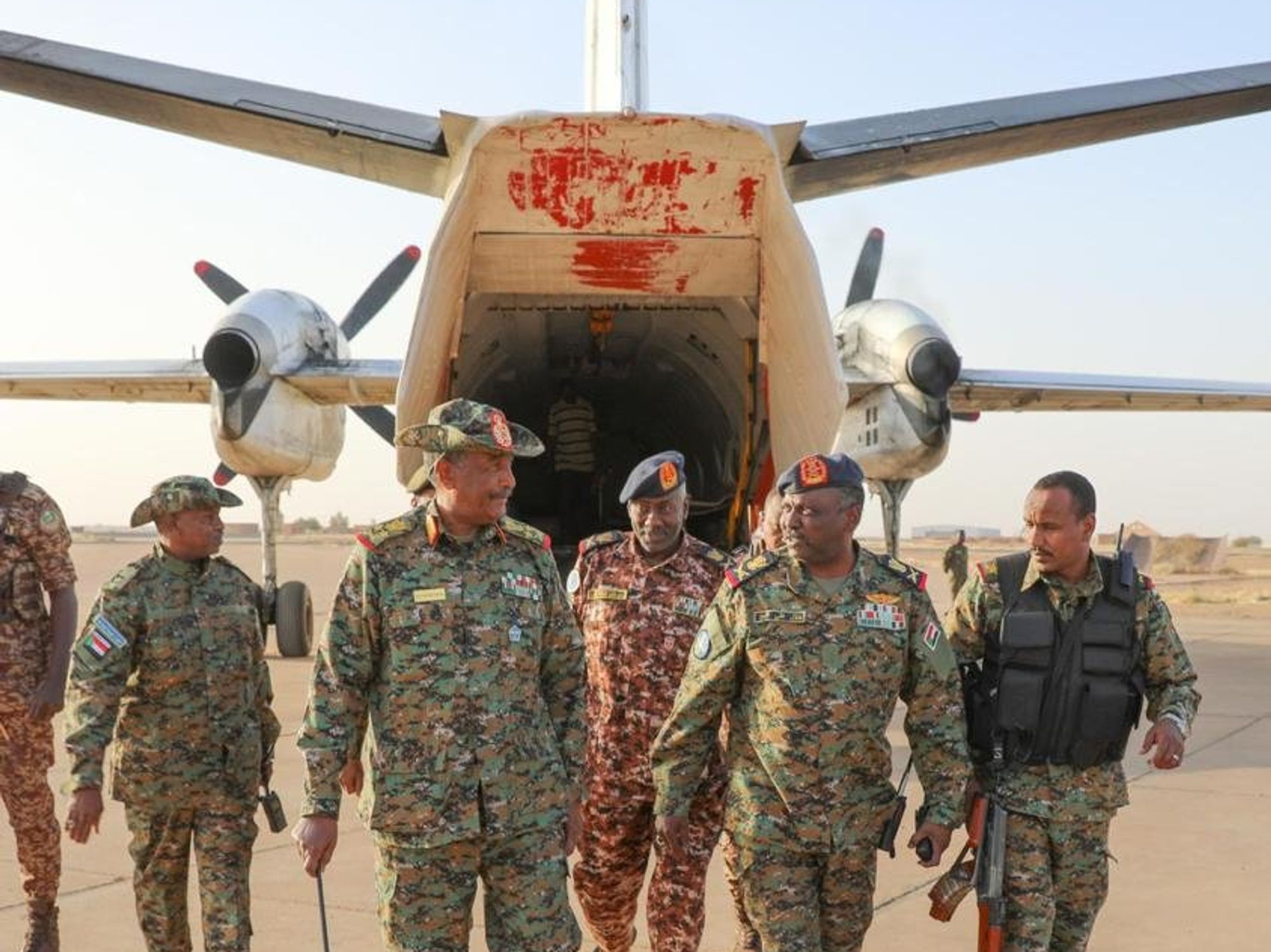 Photo showing General Commander of the Sudanese Armed Forces (SAF) Abdel Fattah Al-Burhan (L, front) arriving in Omdurman city, northwest of Sudan's capital Khartoum, on March 12