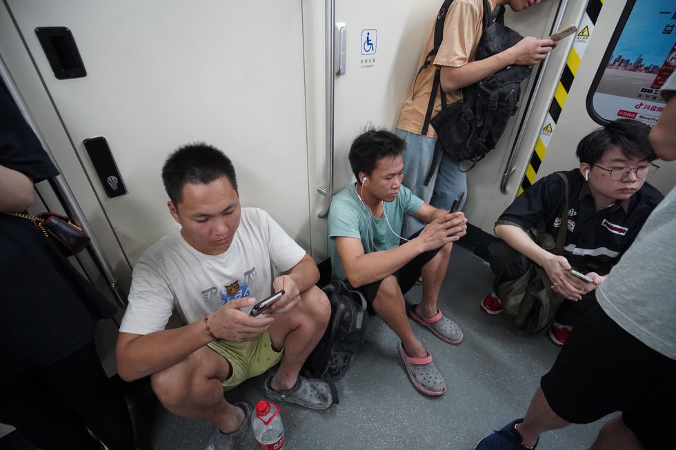 Photo showing people taking a subway train in Guangzhou.