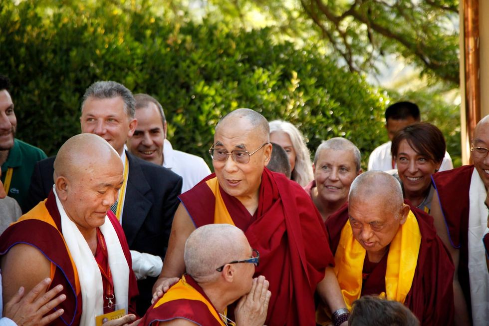 Photo taken by Tenzin Peljor, showing the Dalai Lama visiting a Buddhist community in Naples, Italy