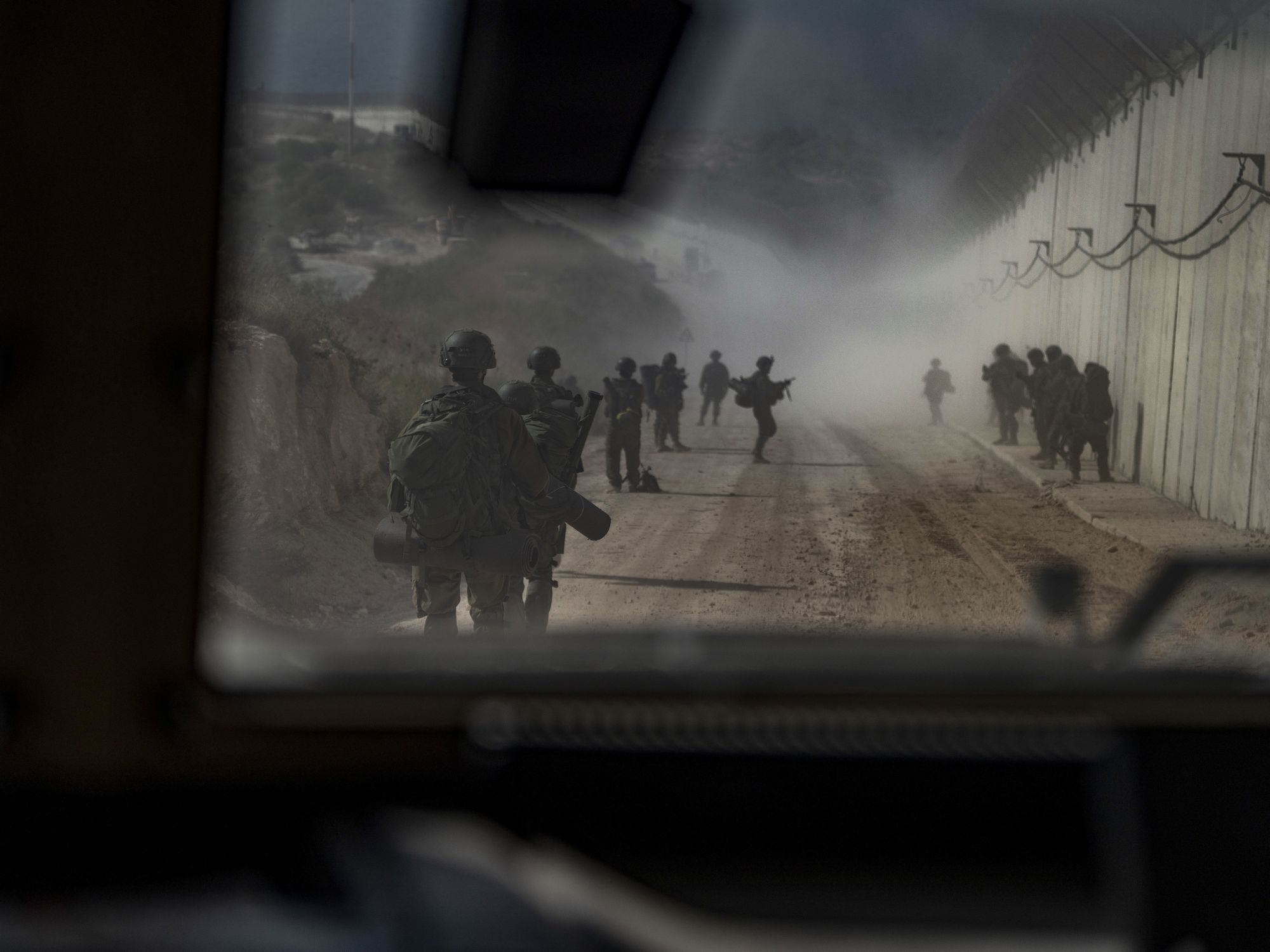 Photo taken from the inside of a car of IDF soldiers walking in the southern Lebanese village of Naqoura along the border with Israel.