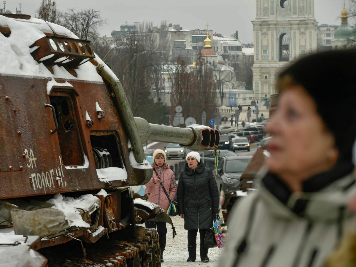 Photo walking by a disused Russian tank in Kyiv on Jan. 13
